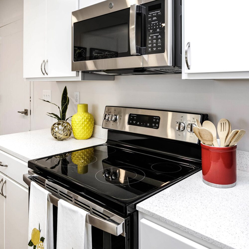 Stainless steel microwave and stove at The Arno apartments